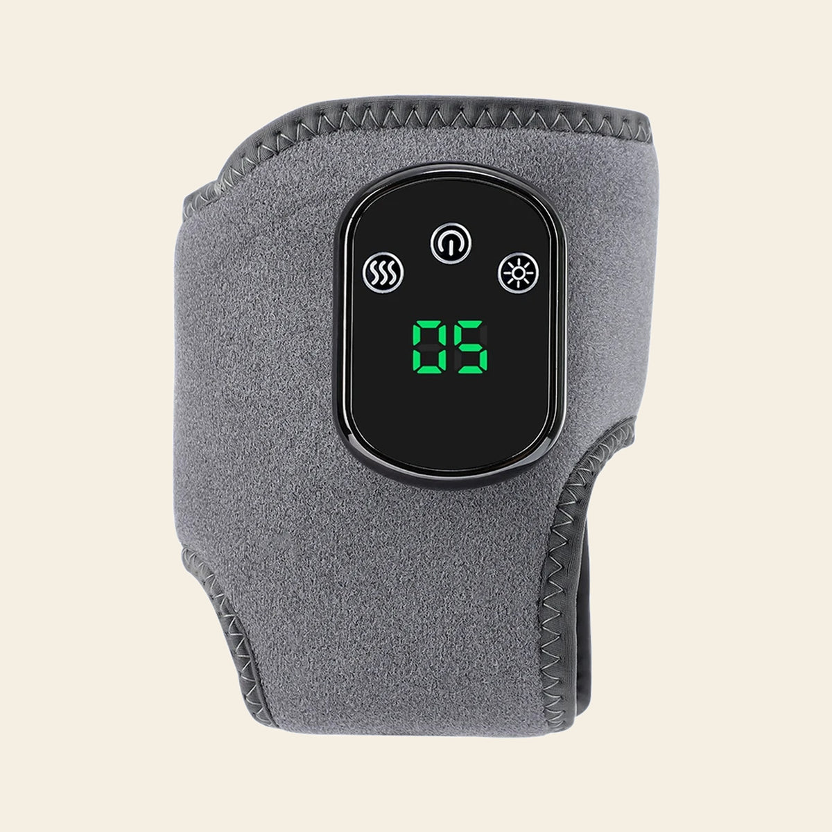 Grey heated ankle and foot wrap with its LED control panel showing heat level five