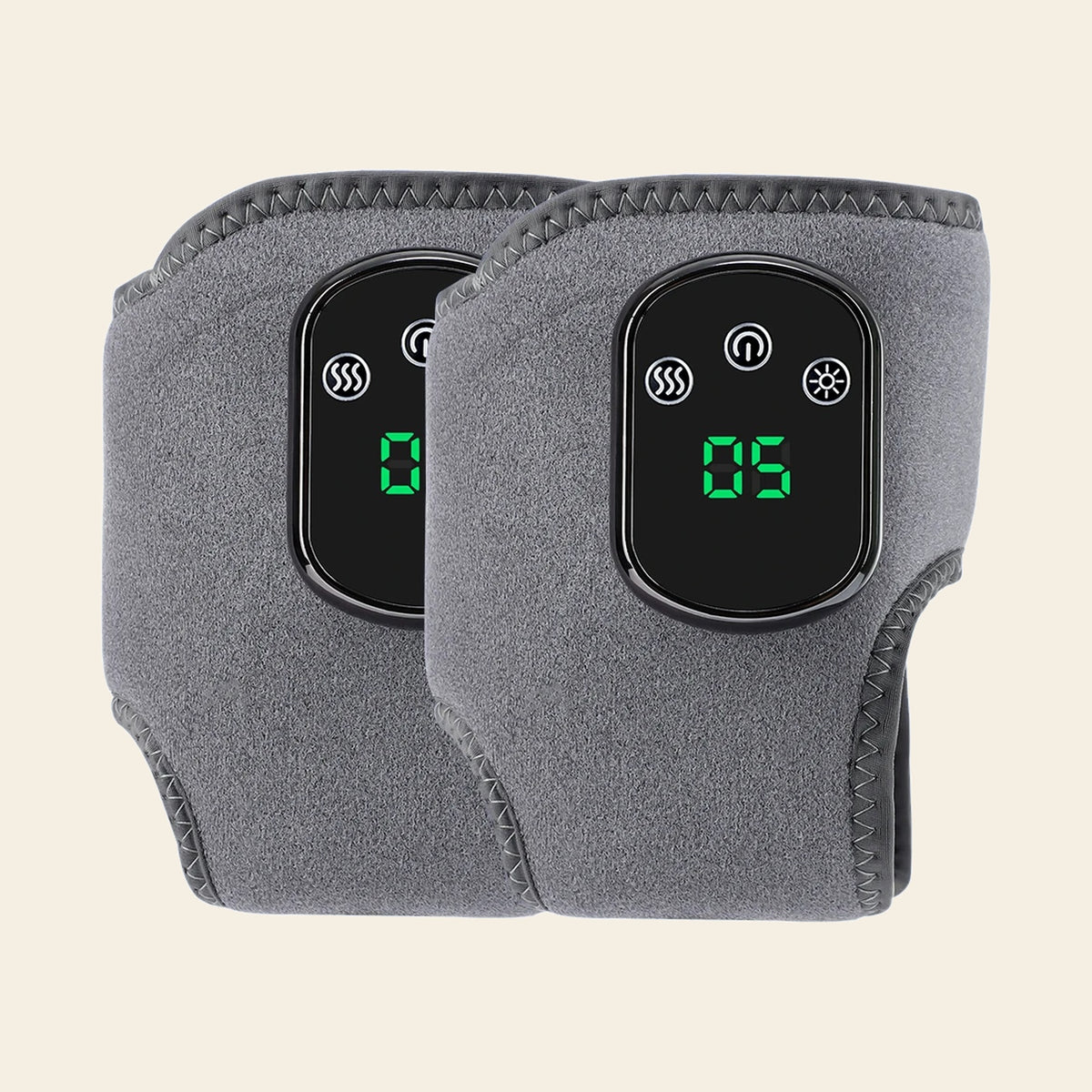 A pair of grey heated ankle wraps side by side, both showing the lit control panel