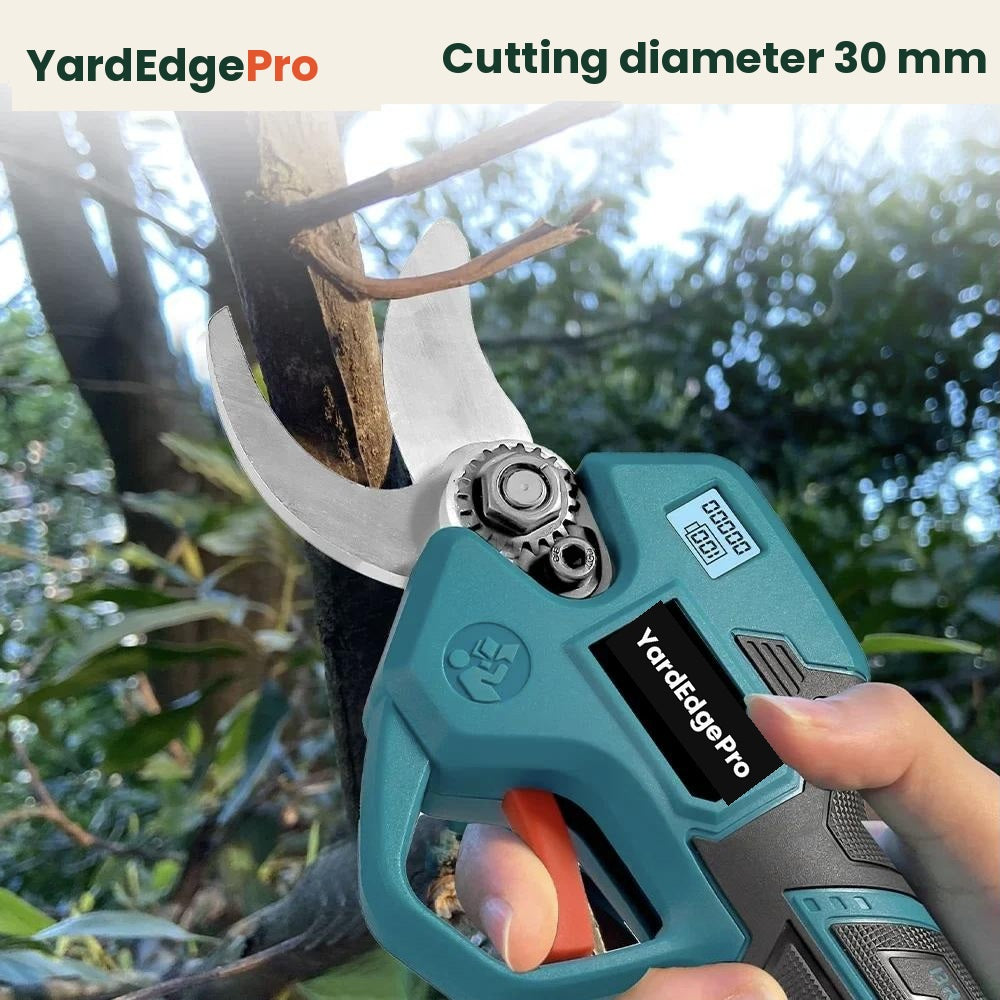 YardEdge Pro cordless pruning shears cutting through a branch in a gloved hand
